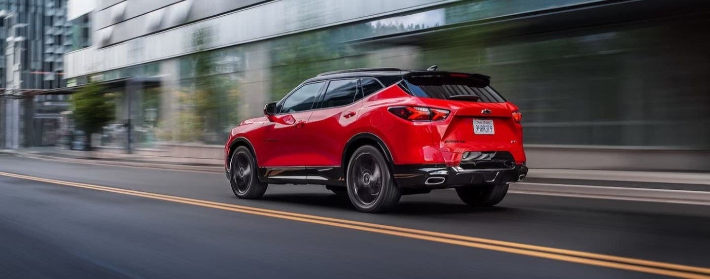 Red 2021 Chevy Blazer RS driving through a city